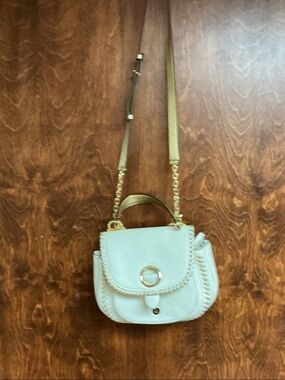 Michael Kors white purse.